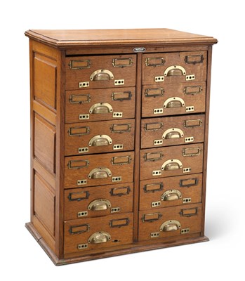 Lot 1290 - AN EARLY 20TH CENTURY OAK BANK OF DRAWERS, BY J. TAYLOR