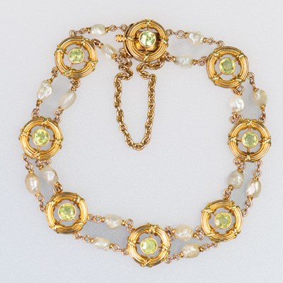 Lot 486 - A LATE 19TH CENTURY PERIDOT AND PEARL BRACELET