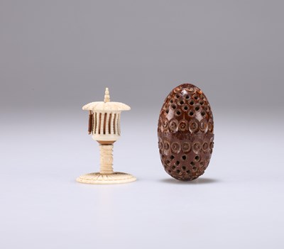 Lot 1170 - A 19TH CENTURY COQUILLA NUT POMANDER AND A 19TH CENTURY BONE TAPE MEASURE