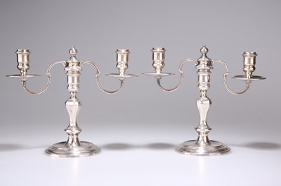 Lot 190 - A PAIR OF SILVER-PLATED TWO-LIGHT CANDELABRA