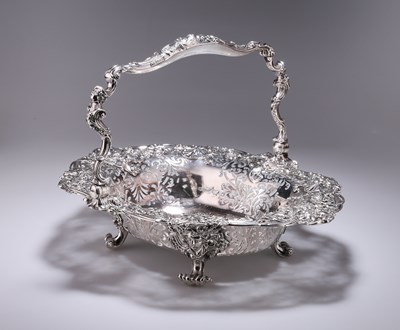 Lot 372 - A GEORGE II SILVER CAKE BASKET