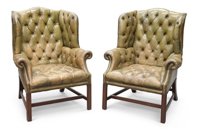 Lot 69 - A PAIR OF GEORGIAN STYLE GREEN LEATHER AND MAHOGANY WING-BACK ARMCHAIRS