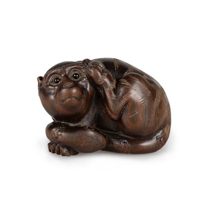 Lot 1060 - A JAPANESE FRUITWOOD NETSUKE