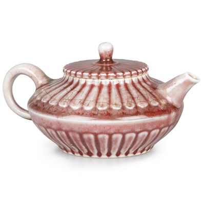 Lot 67 - A JUN-TYPE COPPER-RED PORCELAIN TEAPOT AND COVER