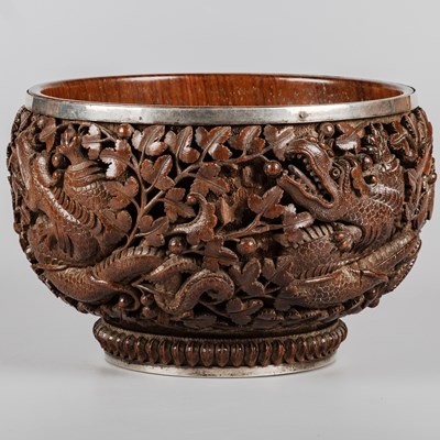 Lot 129 - A 19TH CENTURY BURMESE HARDWOOD BOWL WITH A WHITE-METAL RIM