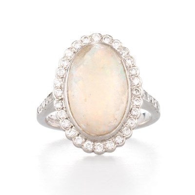 Lot 559 - A PLATINUM OPAL AND DIAMOND CLUSTER RING