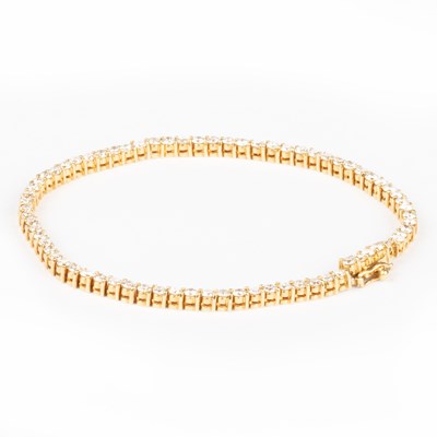 Lot 547 - AN 18 CARAT GOLD DIAMOND LINE BRACELET