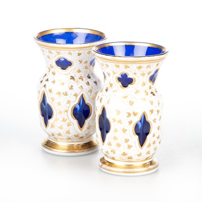 Lot 1009 - A SMALL PAIR OF 19TH CENTURY BOHEMIAN OVERLAY GLASS VASES