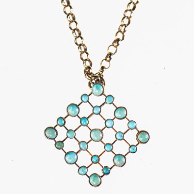 Lot 587 - A TURQUOISE PENDANT ON CHAIN