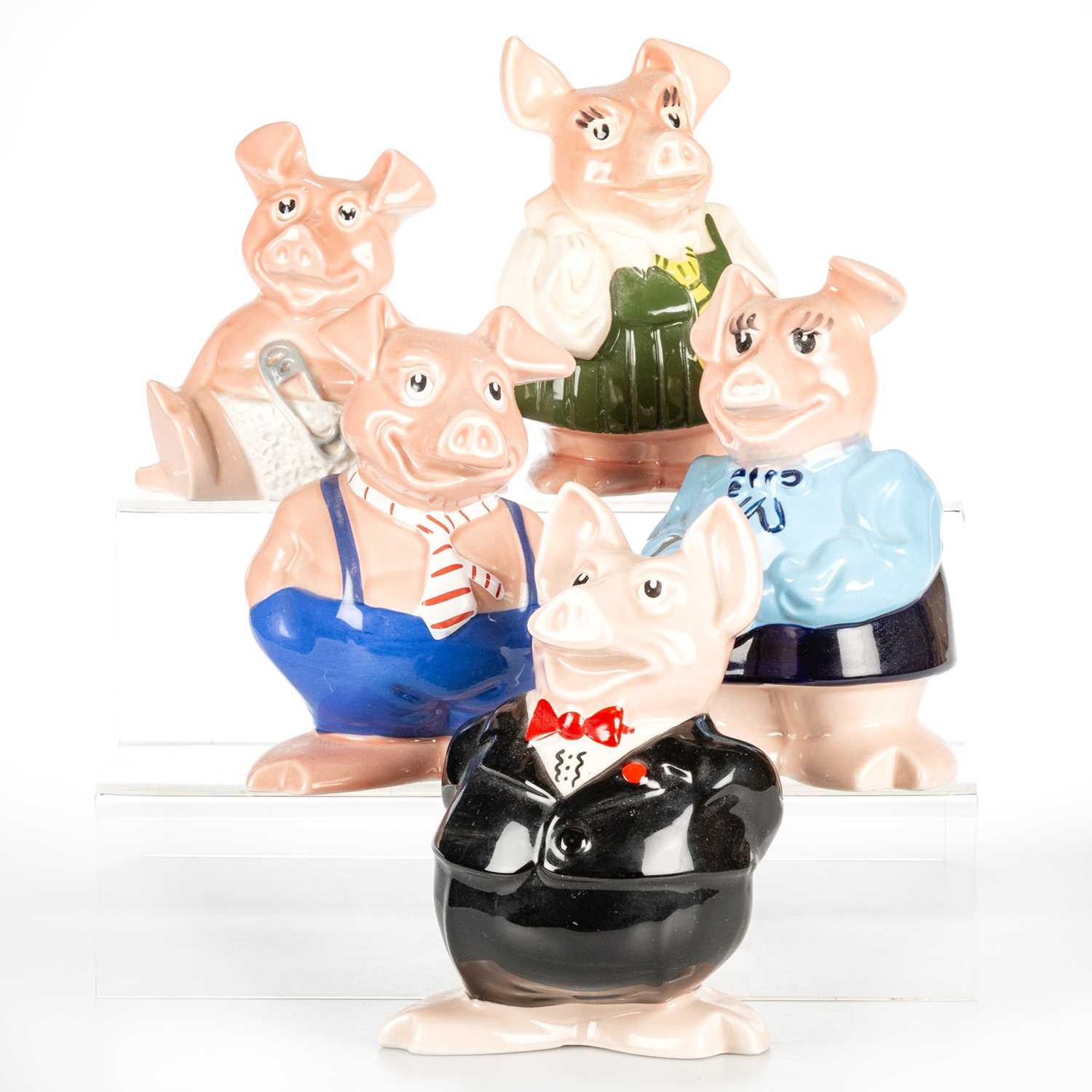 Lot 1041 - A FAMILY OF NATWEST PIGGY BANKS, BY WADE