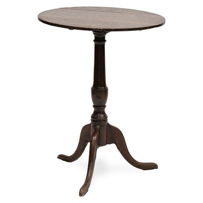 Lot 710 - A GEORGE III OAK TILT-TOP TRIPOD TABLE