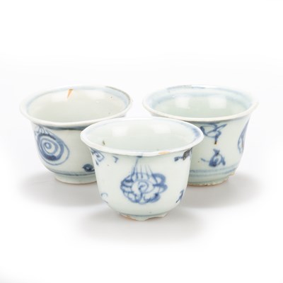 Lot 115 - THREE SMALL CHINESE BLUE AND WHITE BUDDHIST SYMBOLS WINE CUPS, MING 15TH CENTURY