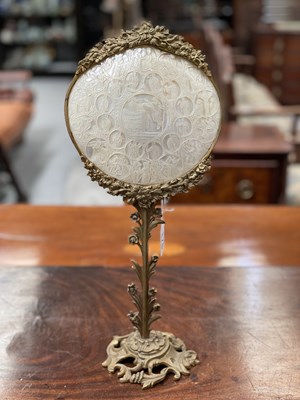 Lot 176 - A 19TH CENTURY GILT-BRASS AND MOTHER-OF-PEARL TABLE SCREEN