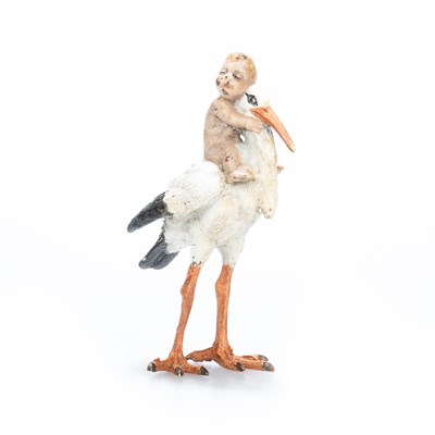 Lot 168 - A COLD PAINTED BRONZE MODEL OF A BABY-BEARING STORK