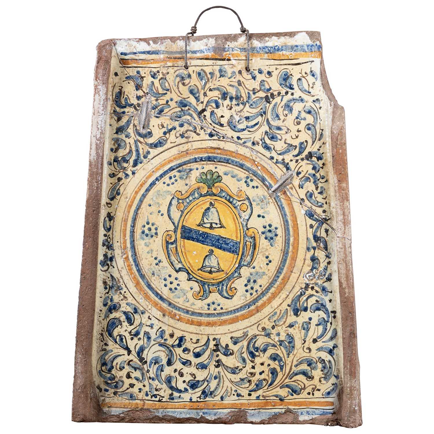 Lot 56 - A 17TH CENTURY SPANISH MAIOLICA ARMORIAL PLAQUE