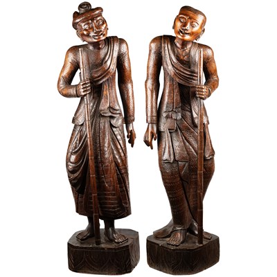 Lot 80 - A VERY LARGE PAIR OF CHINESE CARVED HUANGHUALI FIGURES