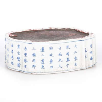 Lot 87 - A CHINESE INSCRIBED BLUE AND WHITE PORCELAIN INKSTONE