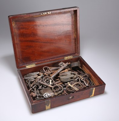 Lot 1253 - A 19TH CENTURY BRASS-MOUNTED MAHOGANY BOX CONTAINING ANTIQUE AND LATER KEYS AND PADLOCKS