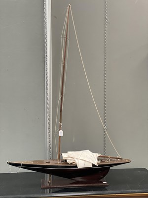 Lot 1002 - A PAINTED WOODEN MODEL OF A YACHT