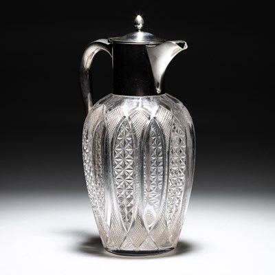 Lot 421 - AN EDWARDIAN SILVER-MOUNTED CUT-GLASS CLARET JUG