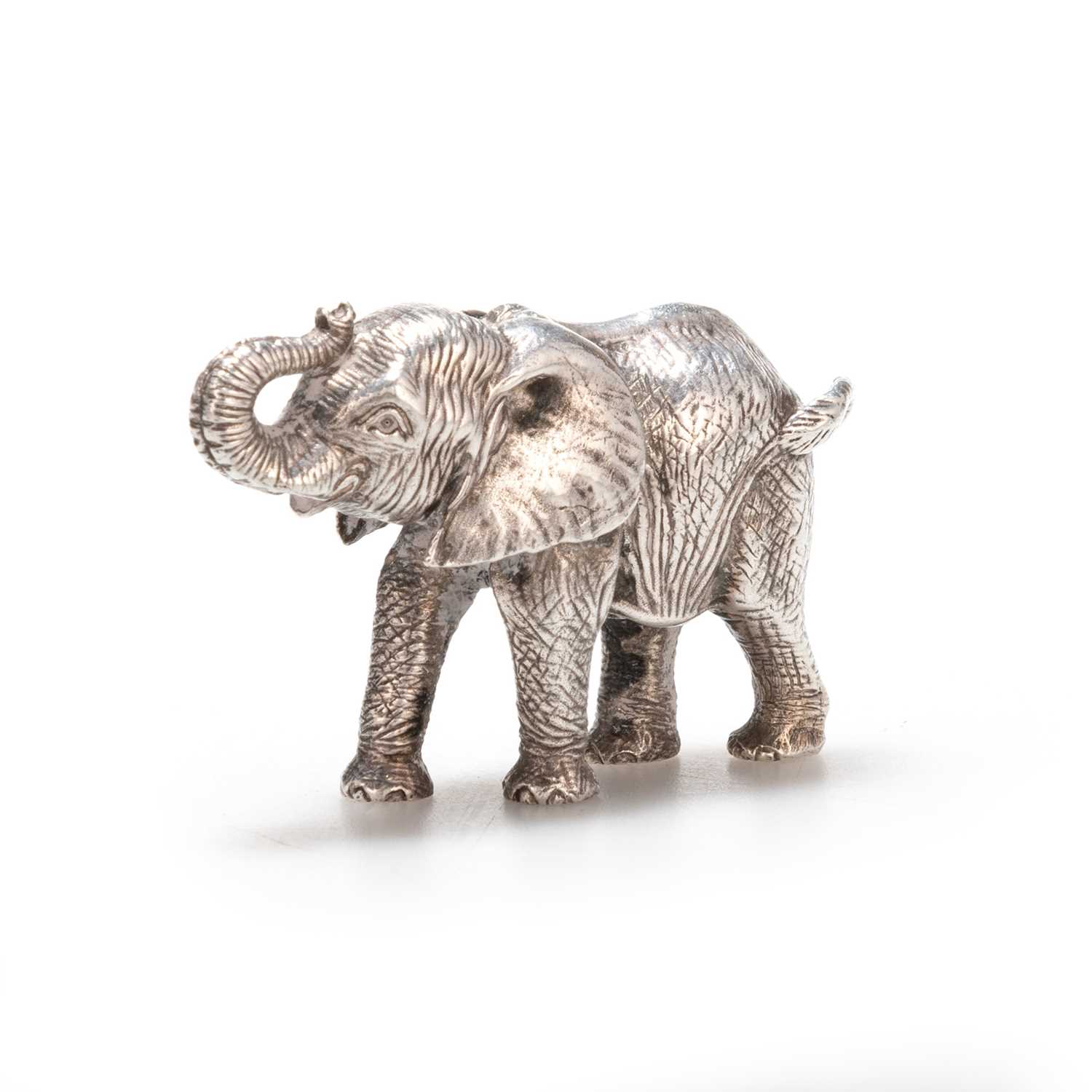 Lot 240 - PATRICK MAVROS: A SILVER SCULPTURE OF A FEMALE CALF ELEPHANT, "KAUME"