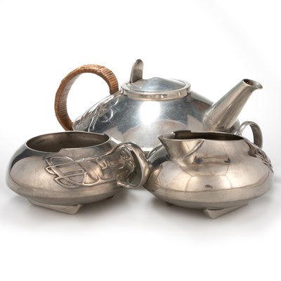 Lot 182 - ARCHIBALD KNOX (1864-1933) FOR LIBERTY & CO, A TUDRIC PEWTER THREE PIECE TEA SERVICE