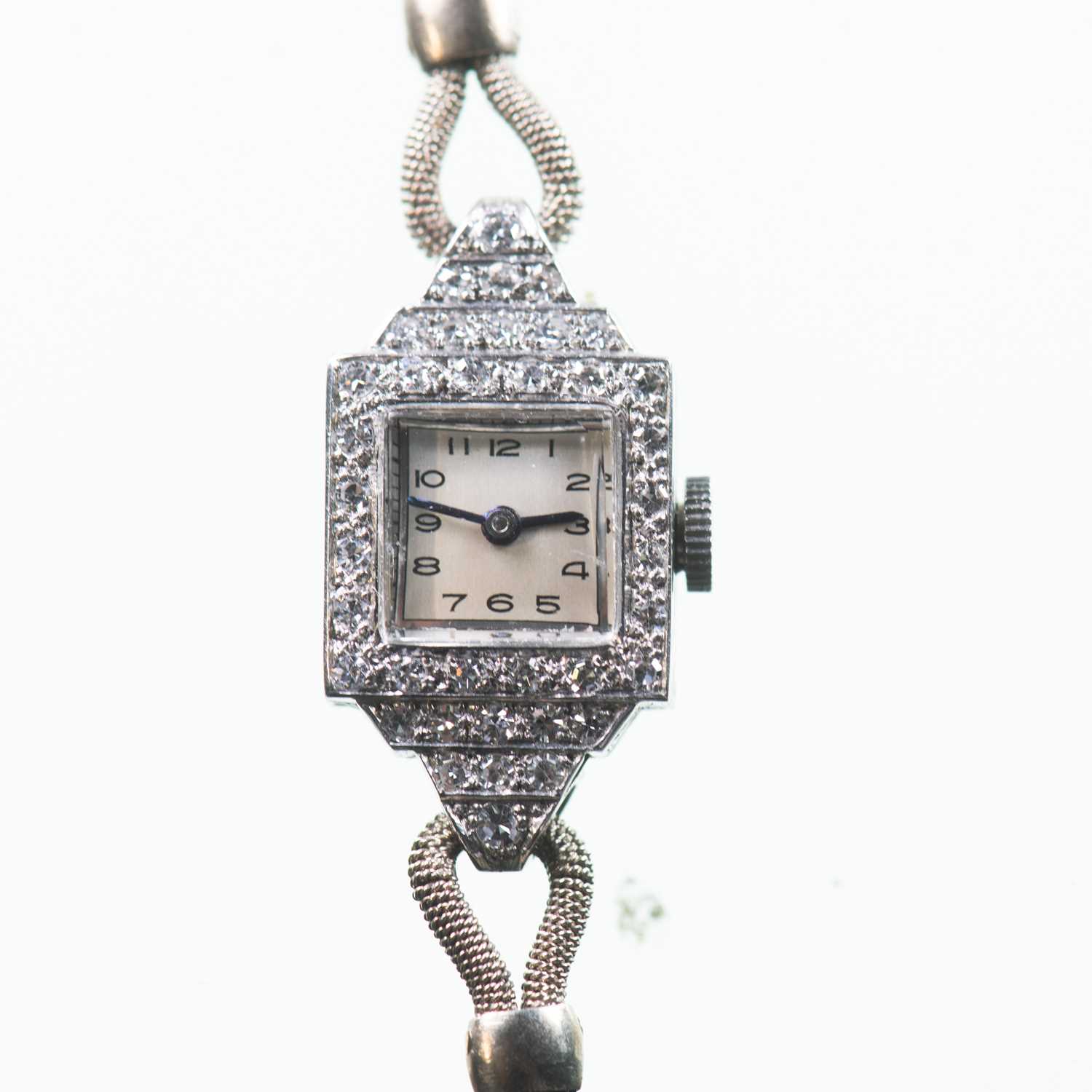 Lot 487 - A LADY'S PLATINUM AND 9CT WHITE GOLD DIAMOND-SET BRACELET WATCH