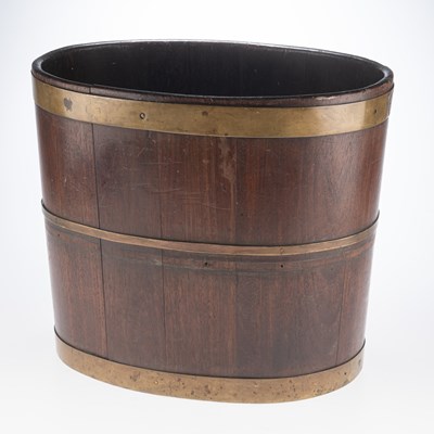 Lot 667 - A GEORGE III BRASS-BOUND MAHOGANY OVAL PEAT BUCKET