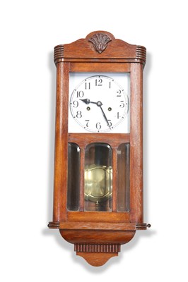 Lot 1220 - A 1930S OAK WALK CLOCK.