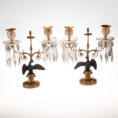 Lot 549 - A PAIR OF REGENCY BRONZE TWO-LIGHT CANDELABRA