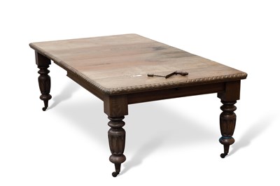 Lot 657 - A 19TH CENTURY OAK WIND-OUT EXTENDING DINING TABLE