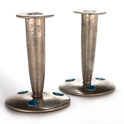 Lot 568 - A PAIR OF LIBERTY & CO TUDRIC PEWTER AND ENAMEL CANDLESTICKS