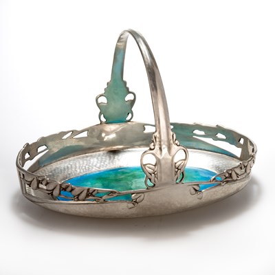 Lot 483 - ARCHIBALD KNOX (1864-1933) FOR LIBERTY & CO, A TUDRIC PEWTER AND ENAMEL CAKE BASKET