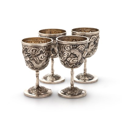 Lot 193 - A SET OF FOUR CHINESE SILVER EGG CUPS