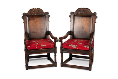 Lot 666 - A LARGE PAIR OF PERIOD STYLE OAK PANEL-BACK ARMCHAIRS