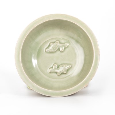 Lot 87 - A CHINESE MOULDED CELADON TWIN-FISH BOWL