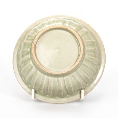 Lot 87 - A CHINESE MOULDED CELADON TWIN-FISH BOWL