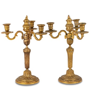 Lot 522 - A PAIR OF LOUIS XVI STYLE GILT-BRONZE THREE-LIGHT CANDELABRA, 19TH CENTURY