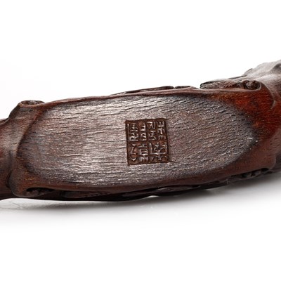 Lot 170 - A CHINESE CARVED WOOD HORN-SHAPED BOAT