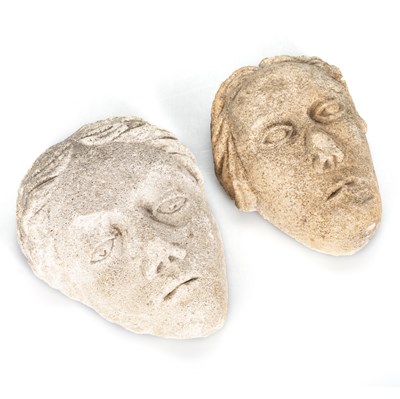 Lot 587 - TWO EARLY CARVED STONE HEADS