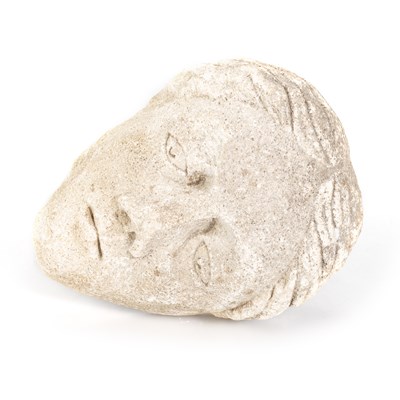 Lot 587 - TWO EARLY CARVED STONE HEADS