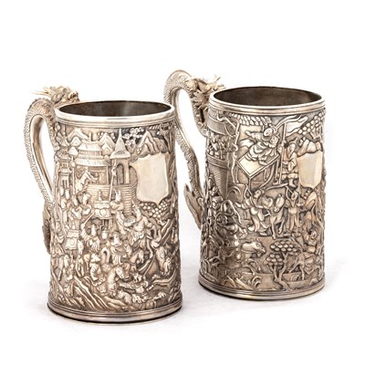 Lot 244 - A NEAR PAIR OF CHINESE EXPORT SILVER TANKARDS