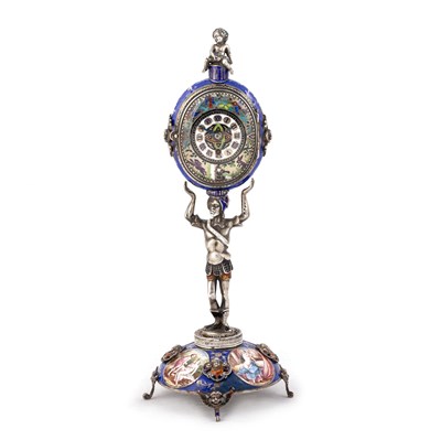 Lot 545 - AN AUSTRIAN SILVER AND ENAMEL FIGURAL STANDING CLOCK