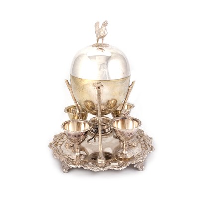 Lot 215 - A SILVER-PLATED EGG CODDLER AND CUPS