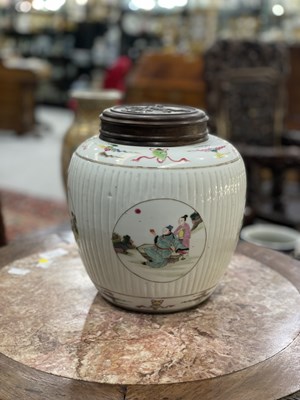 Lot 115 - A CHINESE FAMILLE ROSE FLUTED GINGER JAR AND COVER