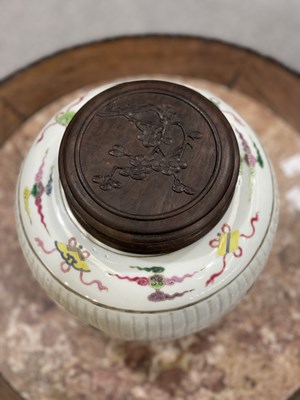 Lot 115 - A CHINESE FAMILLE ROSE FLUTED GINGER JAR AND COVER