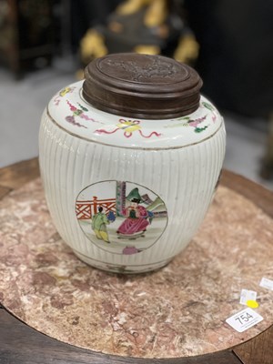 Lot 115 - A CHINESE FAMILLE ROSE FLUTED GINGER JAR AND COVER