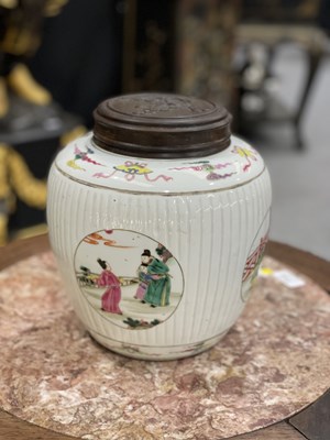 Lot 115 - A CHINESE FAMILLE ROSE FLUTED GINGER JAR AND COVER