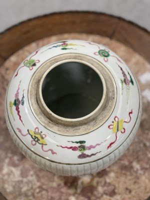 Lot 115 - A CHINESE FAMILLE ROSE FLUTED GINGER JAR AND COVER