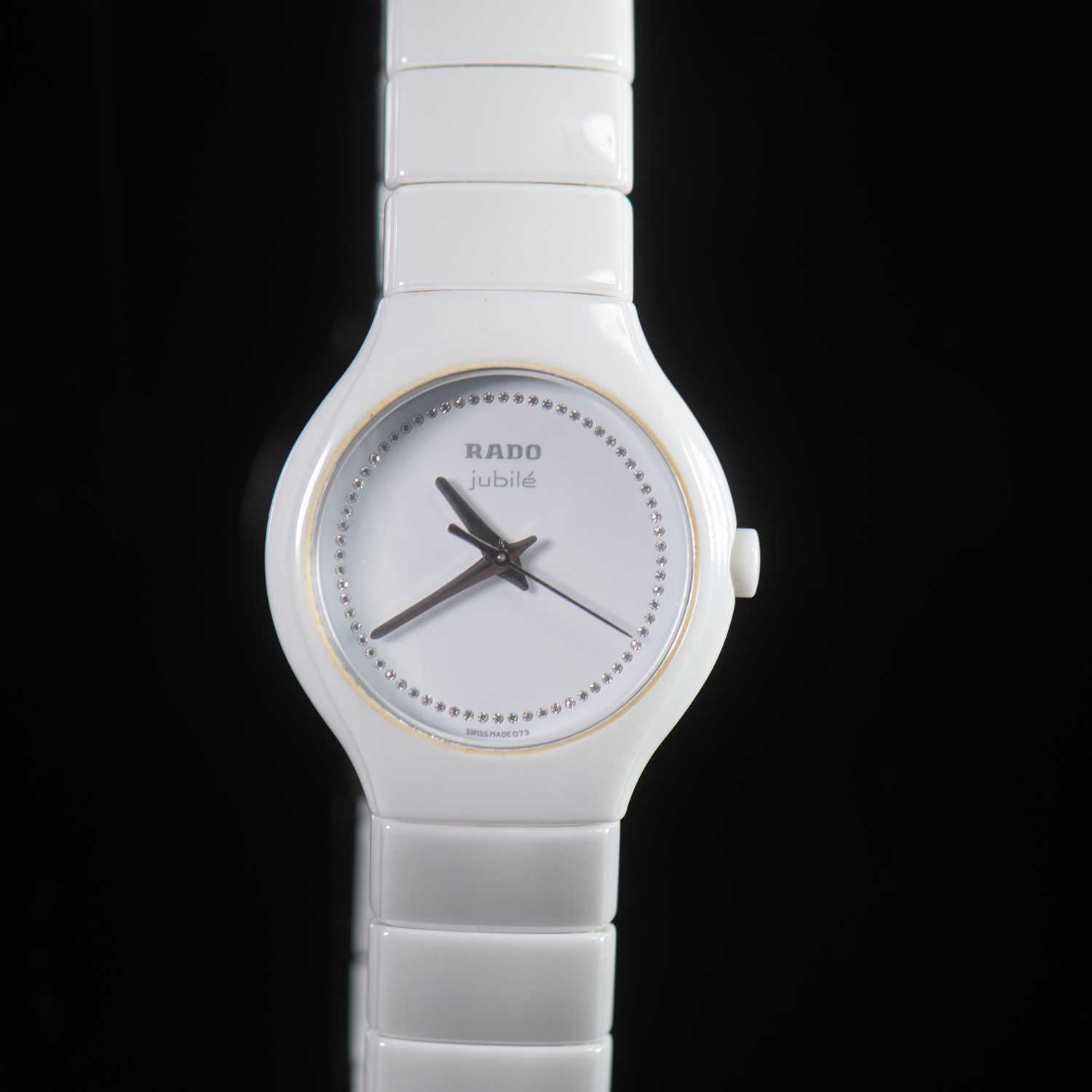 Lot 553 - A LADY'S WHITE CERAMIC RADO DIASTAR BRACELET